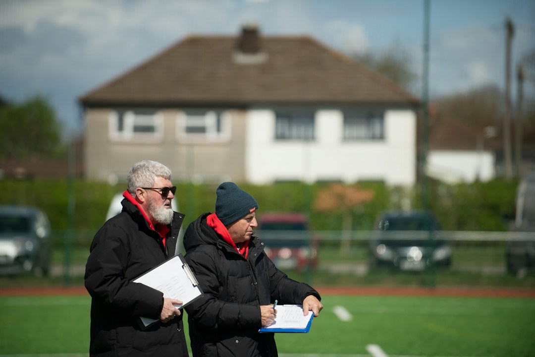 Football professionals meeting on a pitch