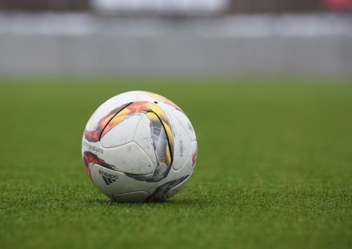 Football on a grass pitch