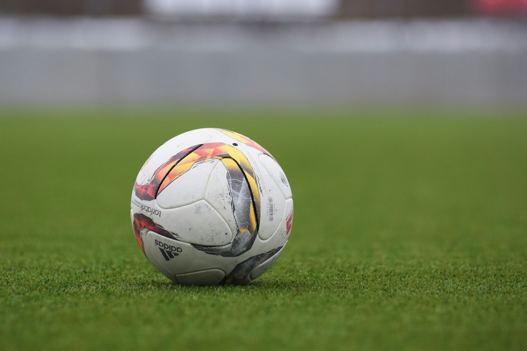 Football on a grass pitch