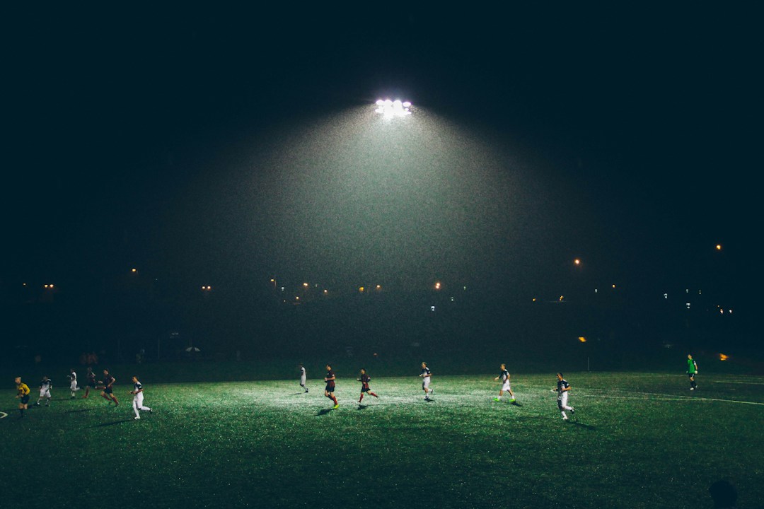 Football at night representing digital and sports technology