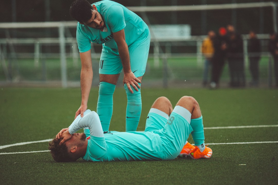 Footballer receiving attention after an injury